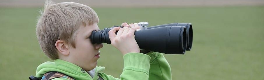 a boy and binoculars
