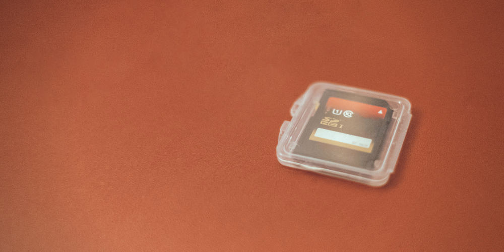 a memory card inside a white transparent case